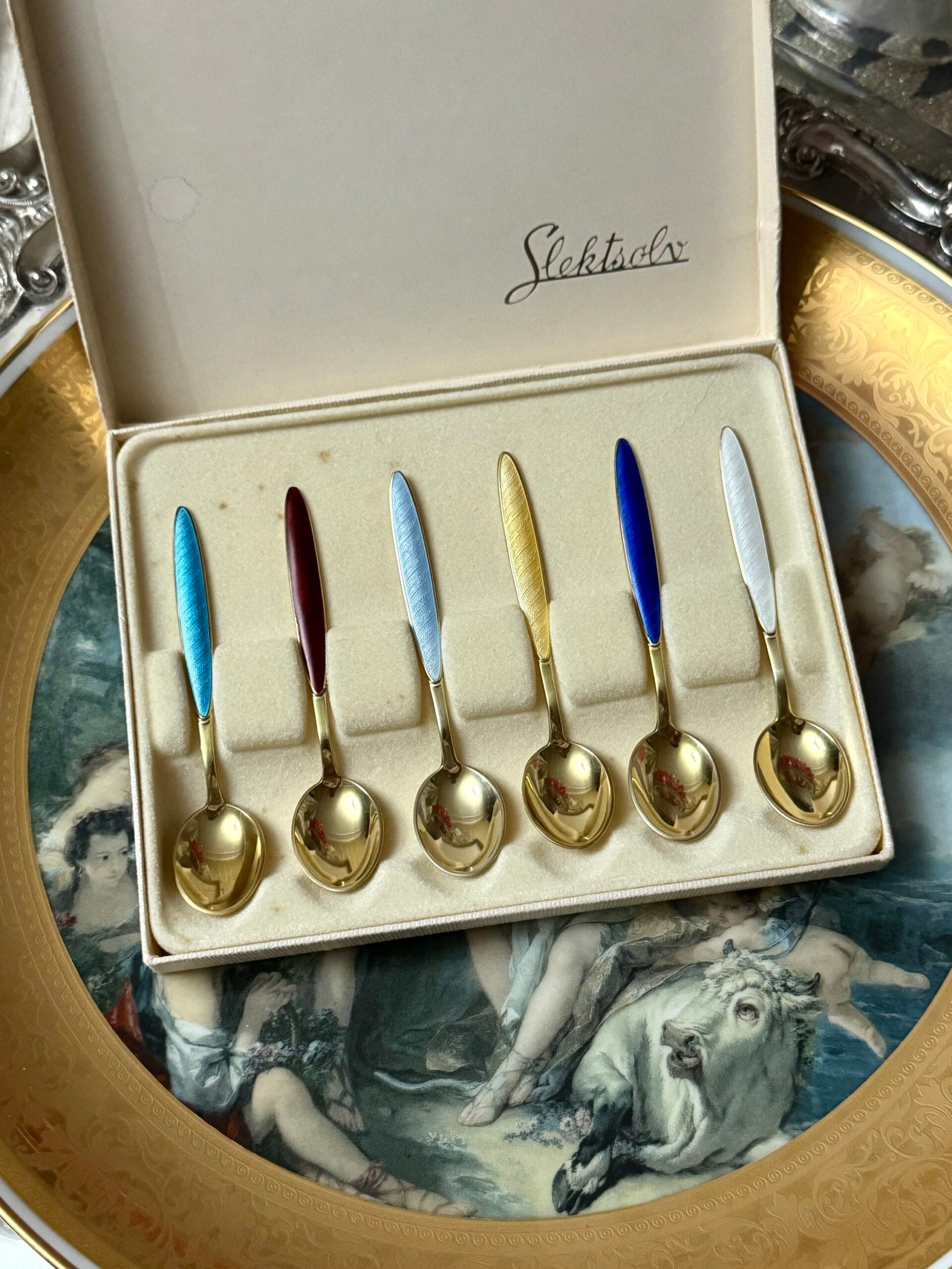 Срібні ложки з емаллю